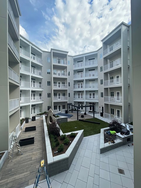 a view of an apartment building with a courtyard