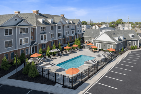 Luxury pool courtyard and resident lounge area at The Rail at North Bergen apartments