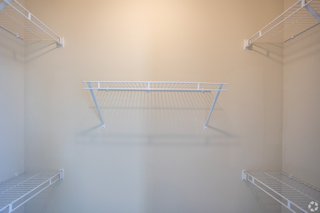 a empty closet in a room with white walls