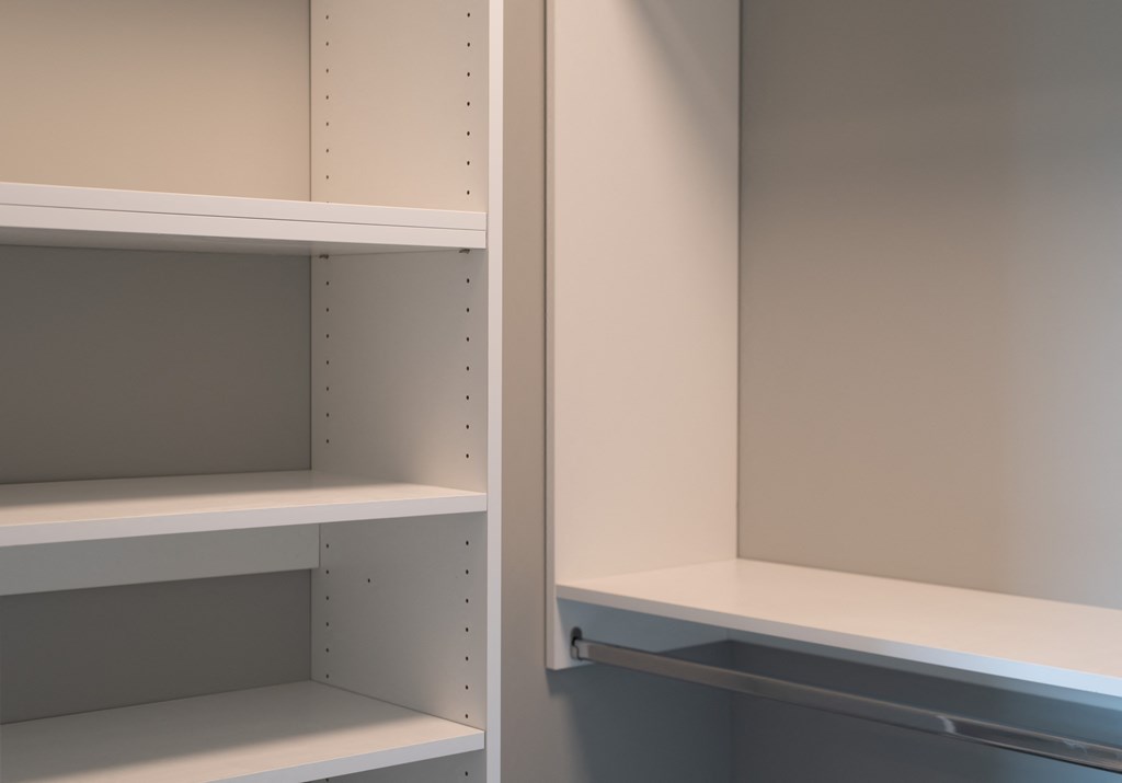 Empty white shelves in closet for organizing
