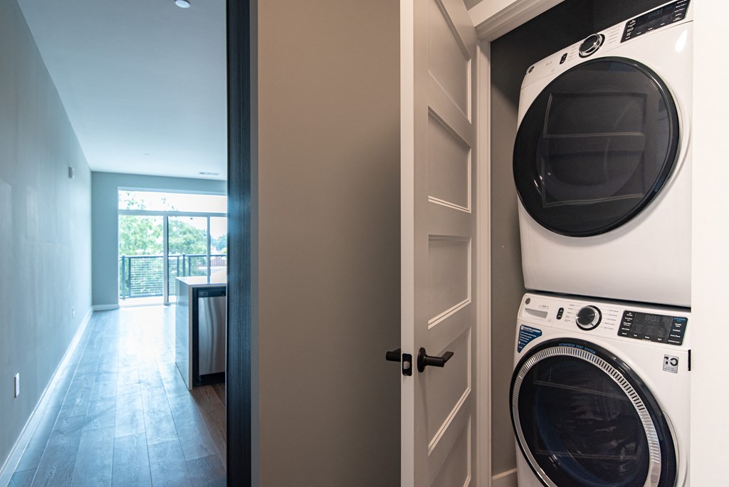 a washer and dryer in a laundry room with a door