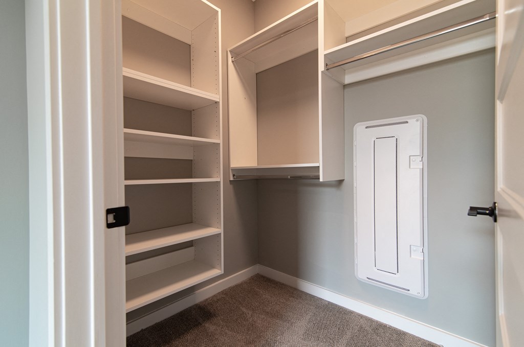 a walk in closet in a new home