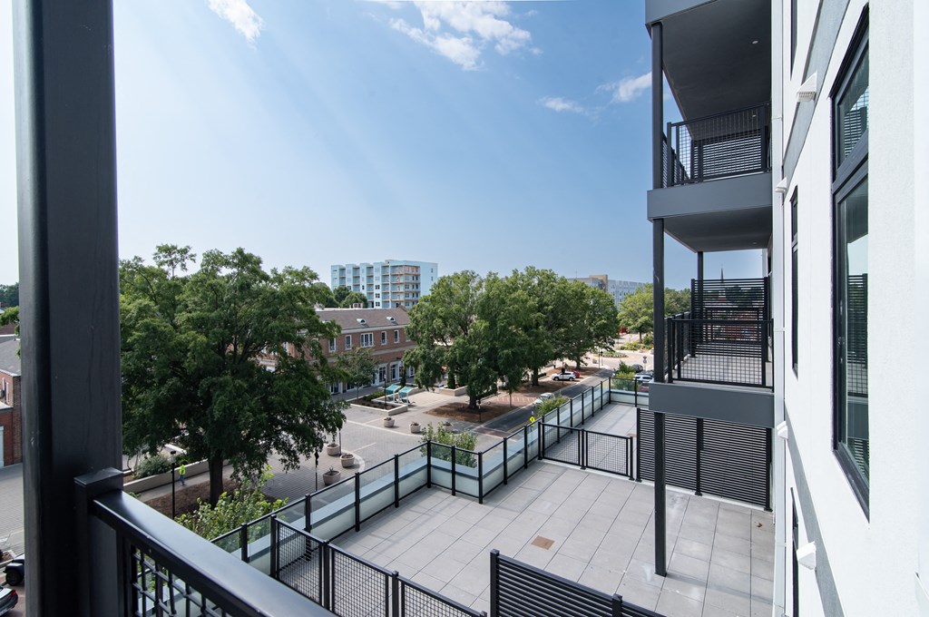 the view from the balcony of an apartment building overlooking the city