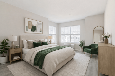 Spacious bedroom with large windows at The Rail North Bergen luxury apartments
