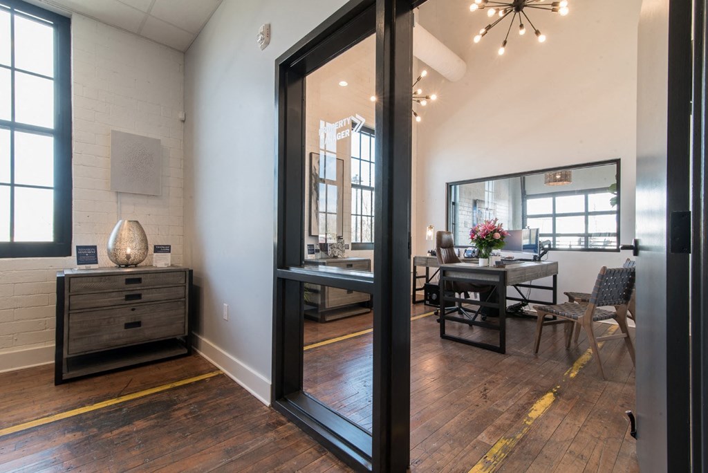a dining room with a large mirror and a table and chairs