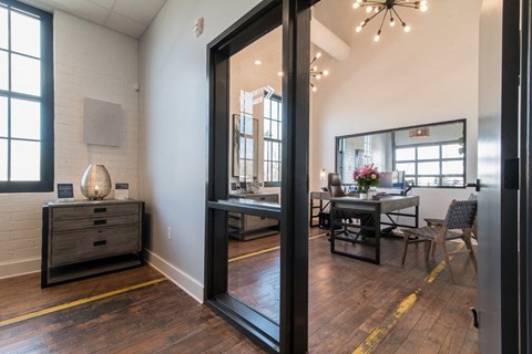 a dining room with a large mirror and a table and chairs