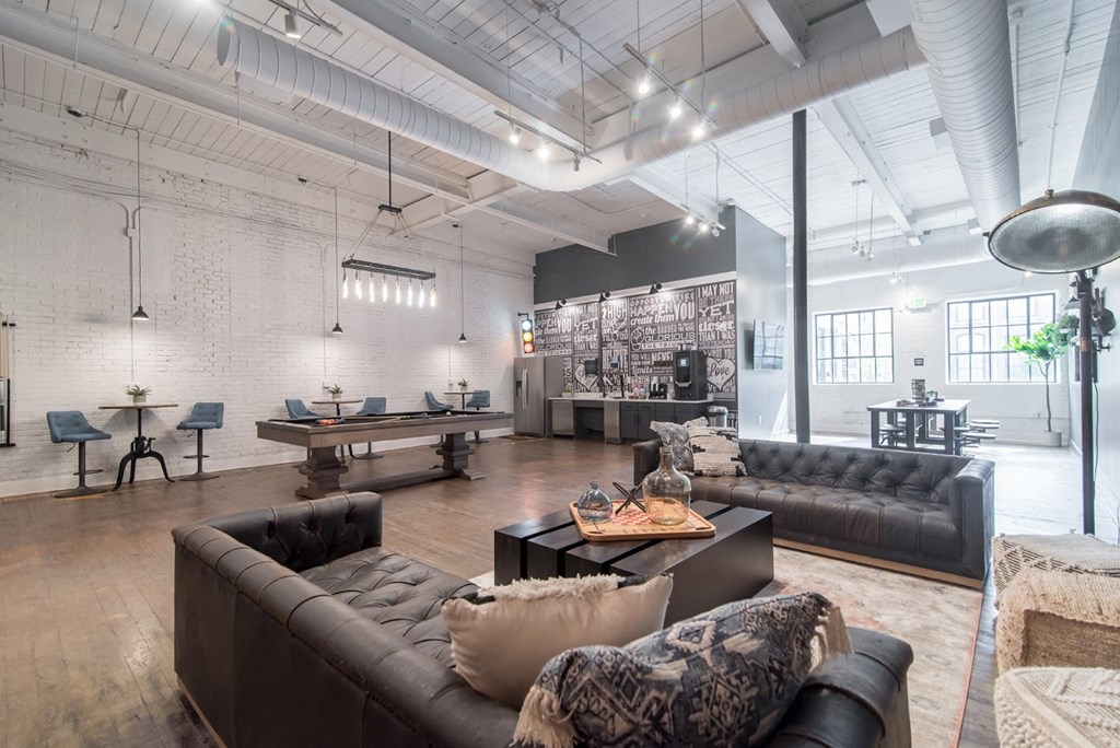 a large living room with couches and a table