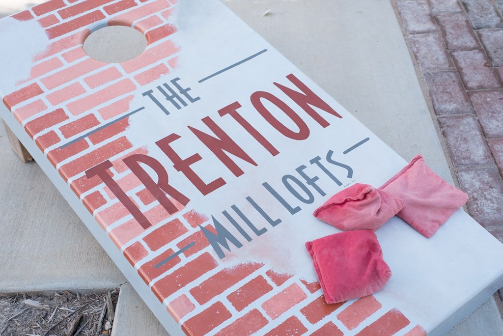 a sign that reads with pink roses on it