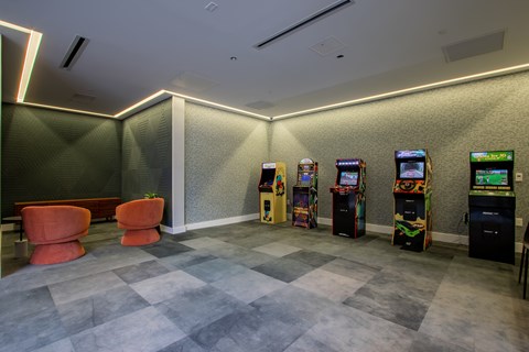 Expansive arcade game area at The Rail in Bound Brook with retro favorites and plush seating in Bound Brook, NJ.