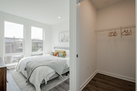 Pet-friendly luxury apartment bedroom in Downtown Bound Brook with oversized windows, abundant natural light, and spacious floorplan near NJ transit.