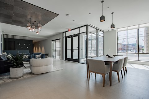 Bright and modern entrance lobby at The Rail at Bound Brook, with stylish furnishings and natural light showcasing downtown Bound Brook living.