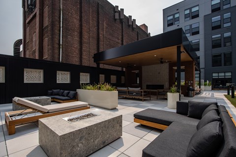 Stylish outdoor seating and fire pits at The Rail at Bound Brook’s landscaped courtyard—highlighting upscale apartment living in Bound Brook, NJ.