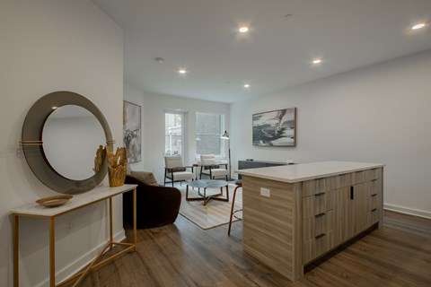 Open-concept living room and kitchen area in a luxury apartment at The Rail at Bound Brook, NJ.