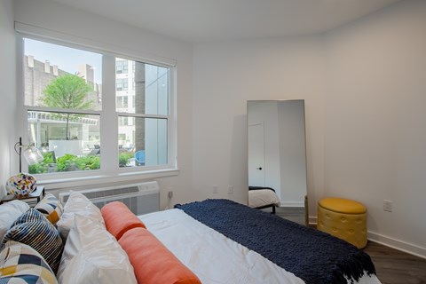 Bedroom view with large windows overlooking the landscaped courtyard at The Rail at Bound Brook, NJ.