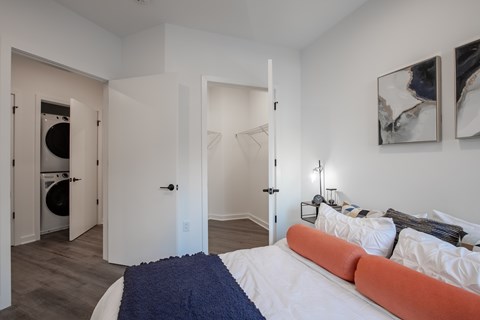 Luxury apartment bedroom with walk-in closet and in-unit washer and dryer at The Rail at Bound Brook, NJ.