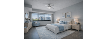 A bedroom with a large bed and a view of the city.