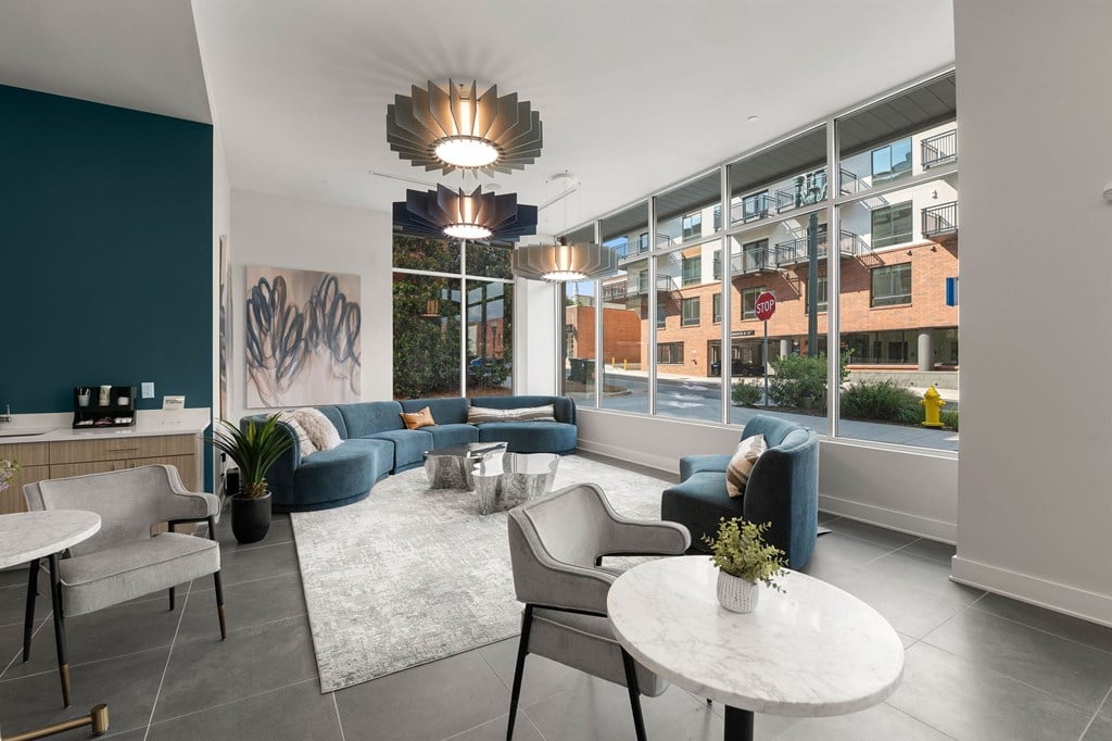 A modern living room with a large window overlooking a cityscape.