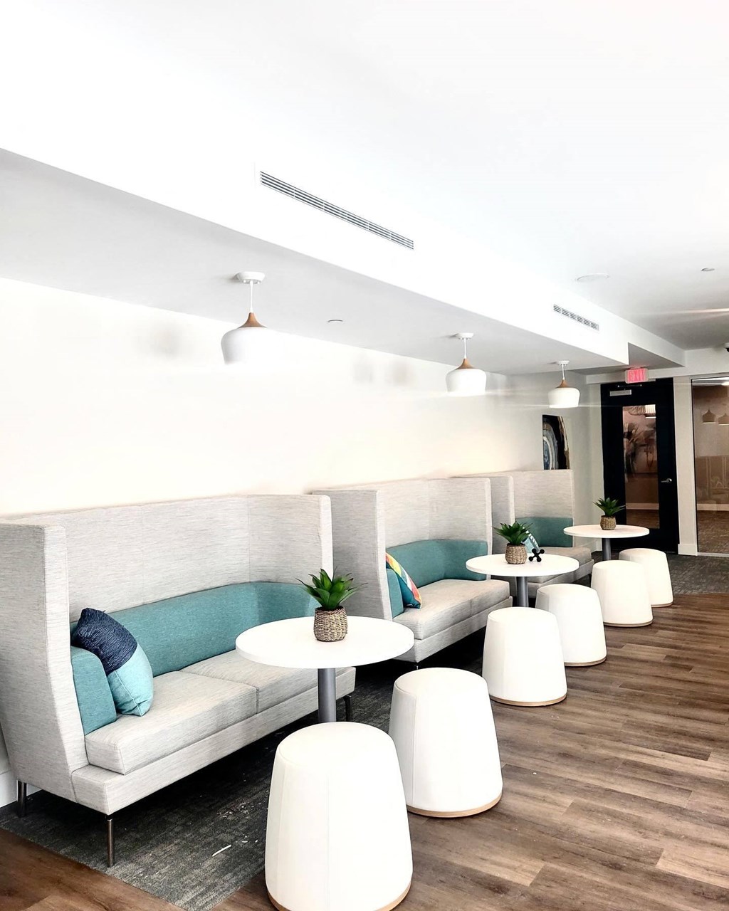 a seating area with couches and tables at Novi Rise, North Carolina