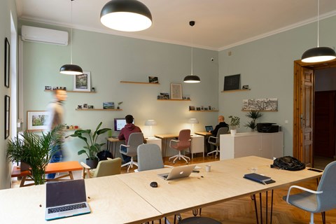 A group of people working in a modern office space.
