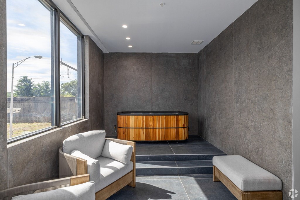 A Room With a Wooden Bench at Hue Soul Apartments, East Orange, New Jersey