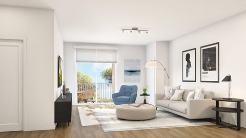 A living room with a blue chair and a white couch.