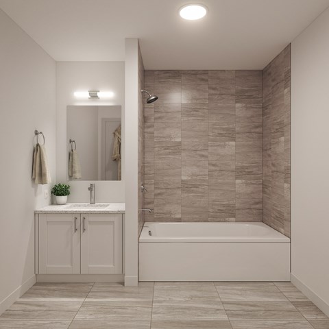 a bathroom with a shower and a sink and a mirror