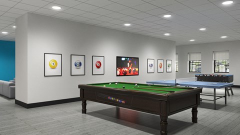 a games room with a pool table and paintings on the wall