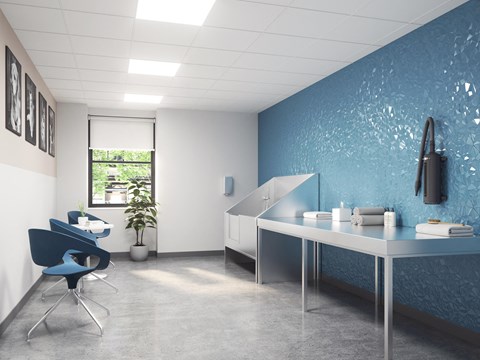 a room with a blue wall and a desk and a chair