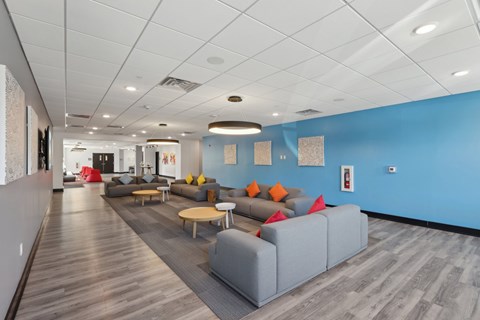 A long hallway with a couch and a coffee table.