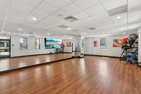 A room with wooden floors and white walls.