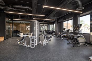 A Gym With a Rowing Machine at Hue Soul Apartments, New Jersey