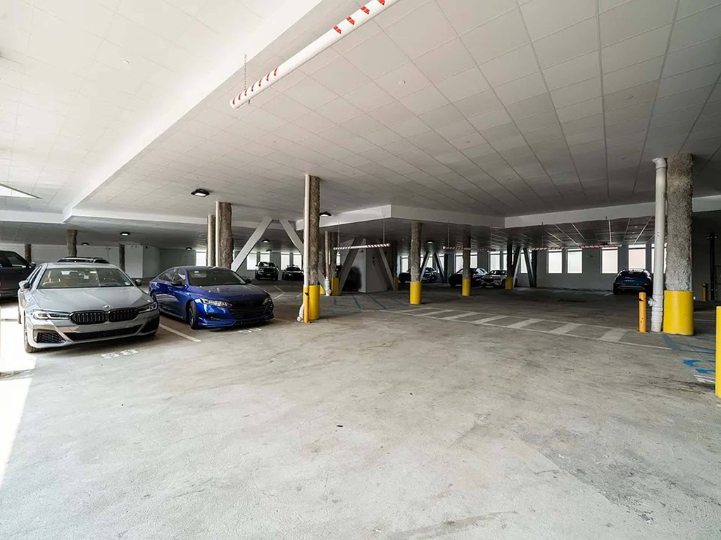 A parking garage with two cars parked at Crossroads 389 Apartments, New Jersey