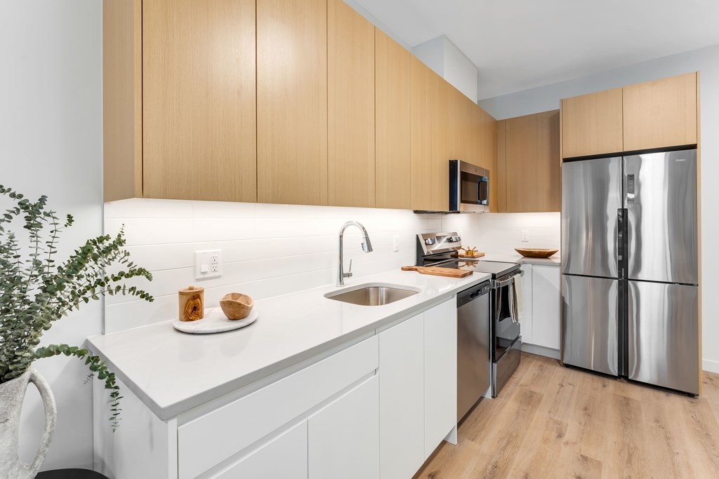 A Kitchen With White Countertop at Hue Soul Apartments, East Orange, NJ, 07018