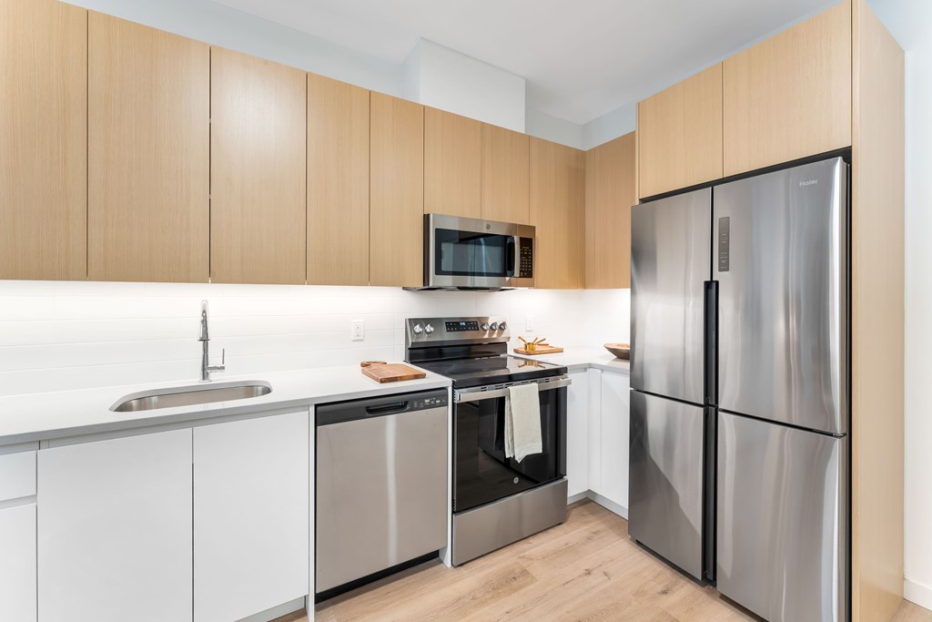 A Kitchen With a Stove at Hue Soul Apartments, East Orange, 07018