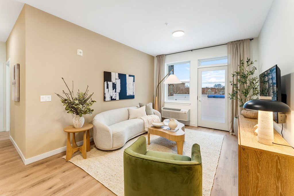 A Living Room With a White Sofa at Hue Soul Apartments, East Orange, 07018