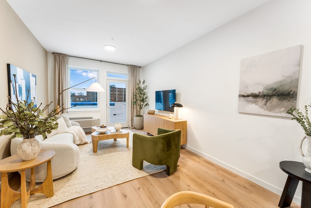 A Living Room With a Plant at Hue Soul Apartments, East Orange, NJ