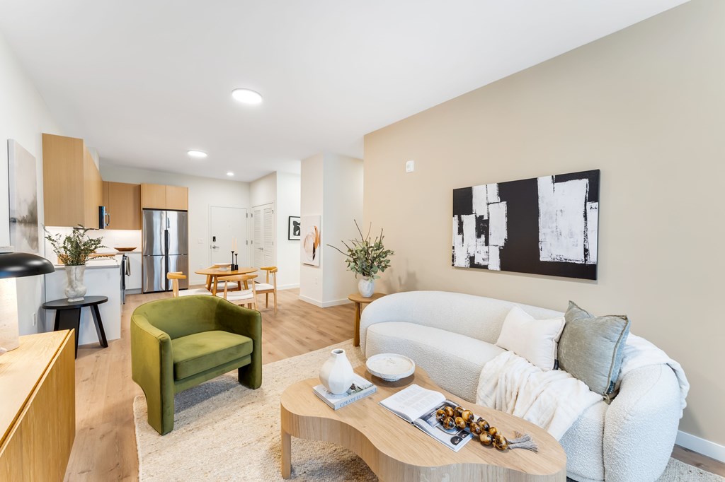 A Living Room With a White Couch at Hue Soul Apartments, East Orange