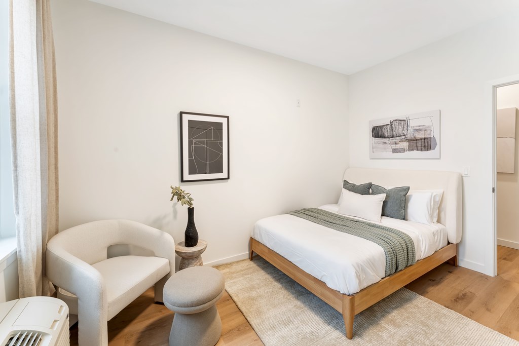 A Bedroom With Small Bed at Hue Soul Apartments, East Orange, NJ, 07018