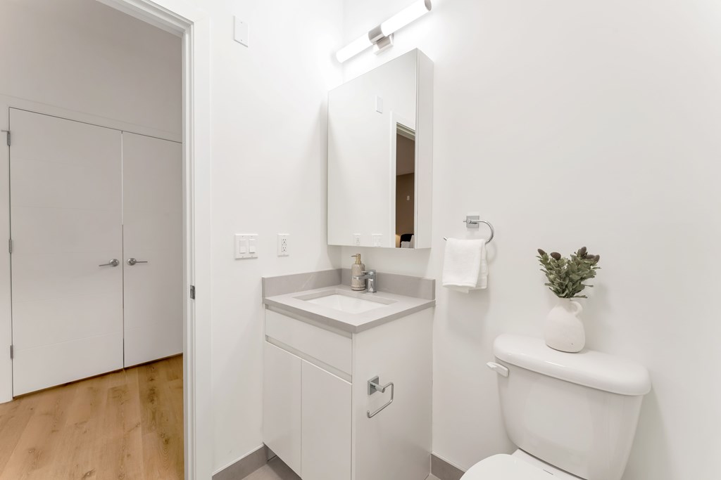 A Bathroom With a Mirror at Hue Soul Apartments, New Jersey