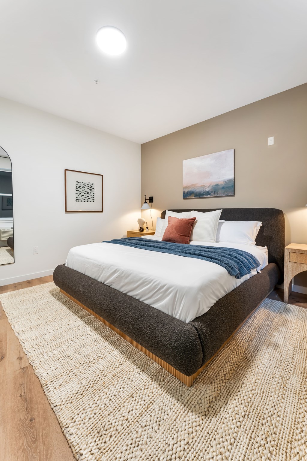 A Bedroom With a Painting on The Wall at Hue Soul Apartments, East Orange, 07018