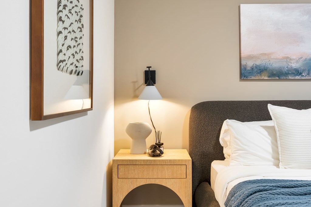 A Bedroom With a Nightstand at Hue Soul Apartments, New Jersey