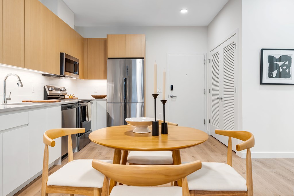 A Kitchen With a Refrigerator at Hue Soul Apartments, East Orange