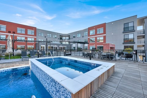 Outdoor pool and spa with sundeck at 34 Eden Lane Apartments, Whippany