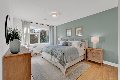 Bedroom with sage accent wall and hardwood floors at 34 Eden Lane Apartments, Whippany, NJ 7981