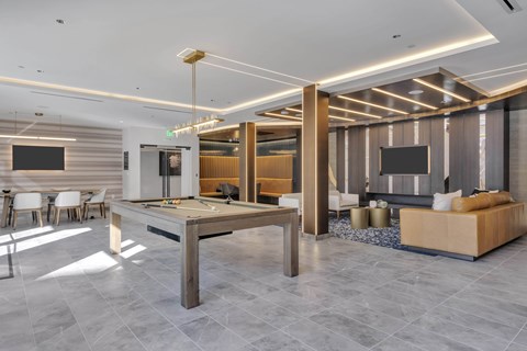 A modern living room with a dining table and a sofa.