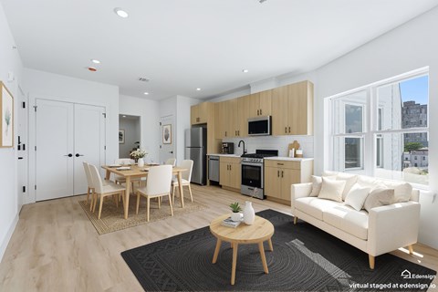 A modern kitchen with wooden cabinets and a dining table with chairs.