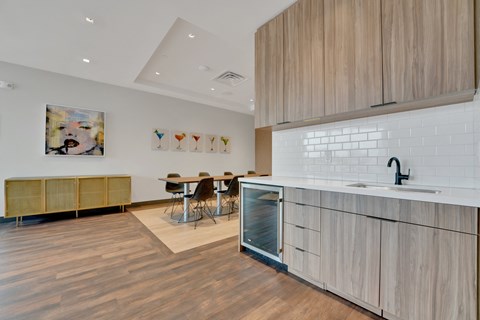 a kitchen with a sink and a counter top in a house