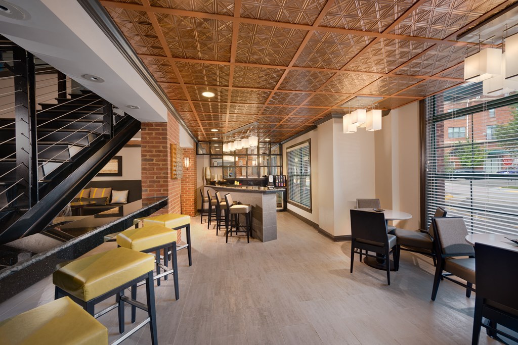 Stylish Resident Lounge with Fireplace, Wet Bar, and Plush Seating Areas at The Cosmopolitan at Lorton Station, Lorton, VA