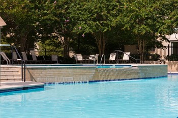 Olympic-Sized Pool with Swimming Lanes, Free Swim Area, and Expansive Sundeck with Chaise Lounge Chairs Best Apartment Rentals in Crystal City Arlington VA - Photo Gallery 5