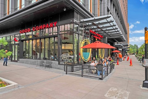 a rendering of a good company restaurant on a city street